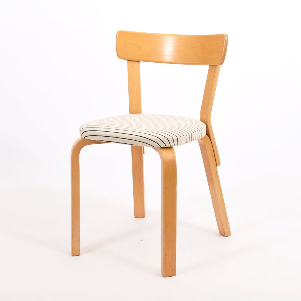 Artek Chair 69, designed by Alvar Aalto in 1935. The chair features a solid birch frame with a broad seat and supportive backrest. The seat has been reupholstered with black and white stripe fabric. Dimensions: 44 x 47 x 80 cm (seat height 45 cm). This is a vintage item from the Artek 2nd Cycle collection.