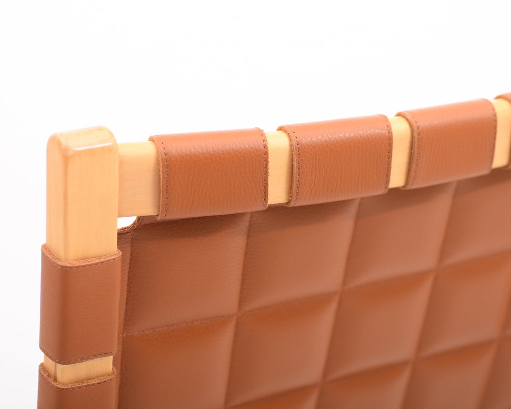 Rear close-up of Armchair 406 with visible frame details and beautifully upholstered leather backrest.