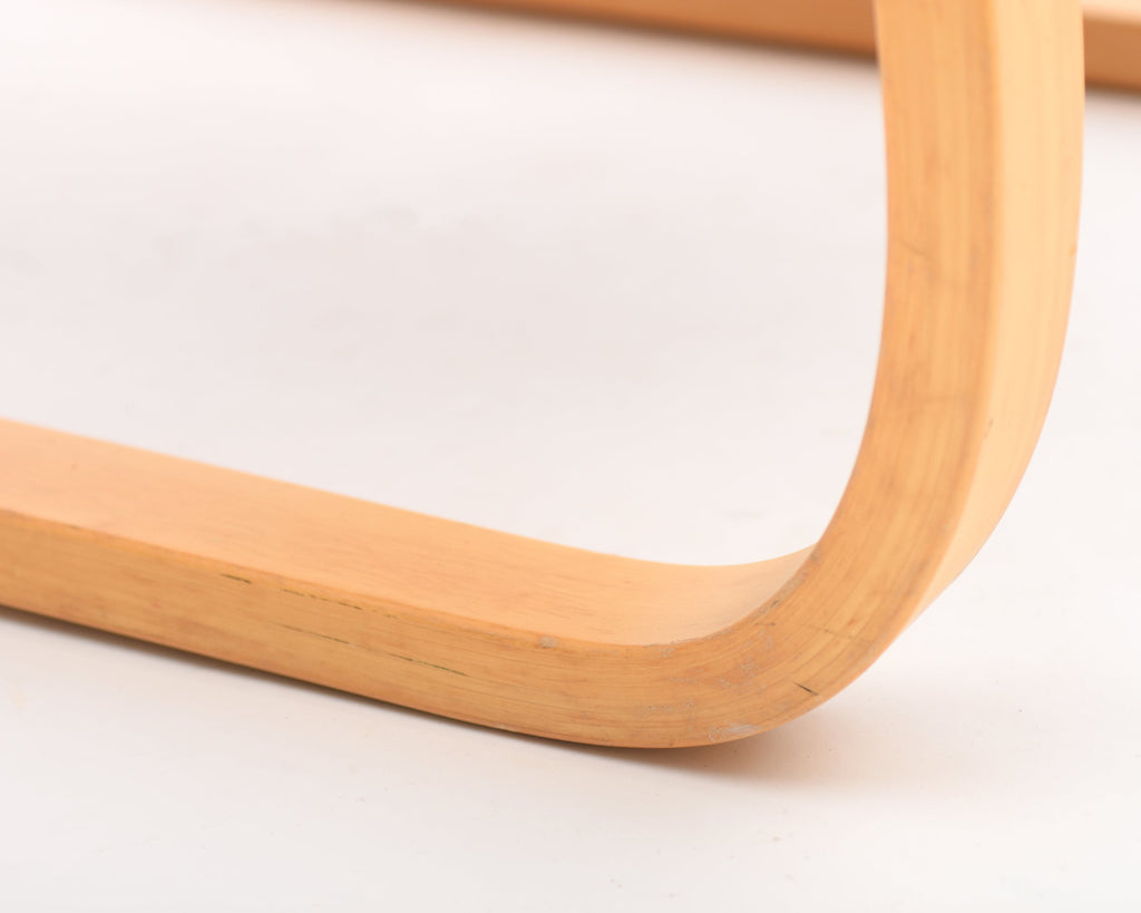 Close-up of a wooden leg on a white background.