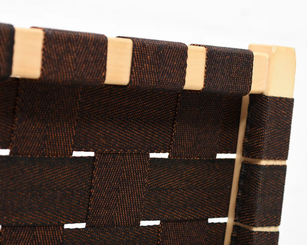 Rear close-up of the backrest, showing how the brown webbing is beautifully attached to the chair frame.