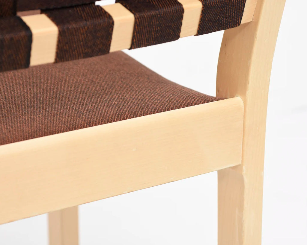 Rear view showing the chair seat and a portion of the backrest and two legs.