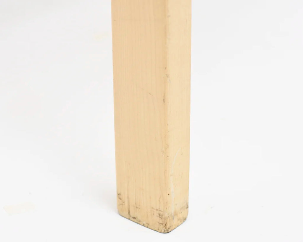 Detail view of the chair leg close to the floor.