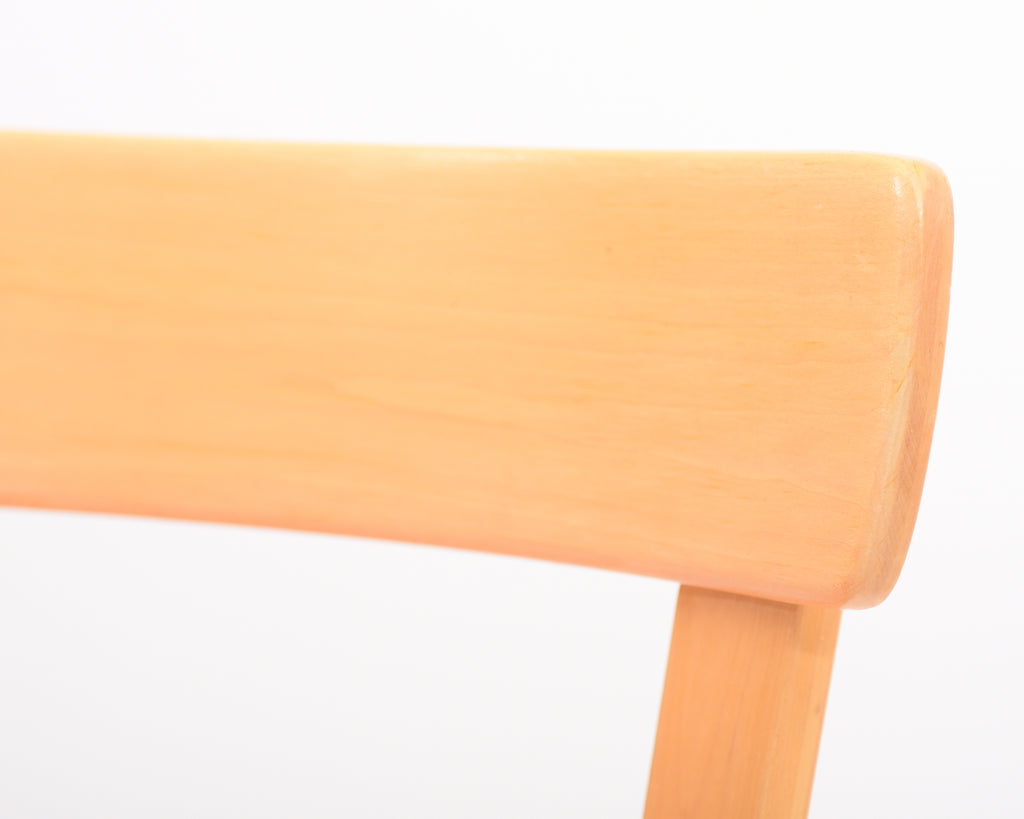 Detailed close-up showing the edge of the 69 chair backrest.
