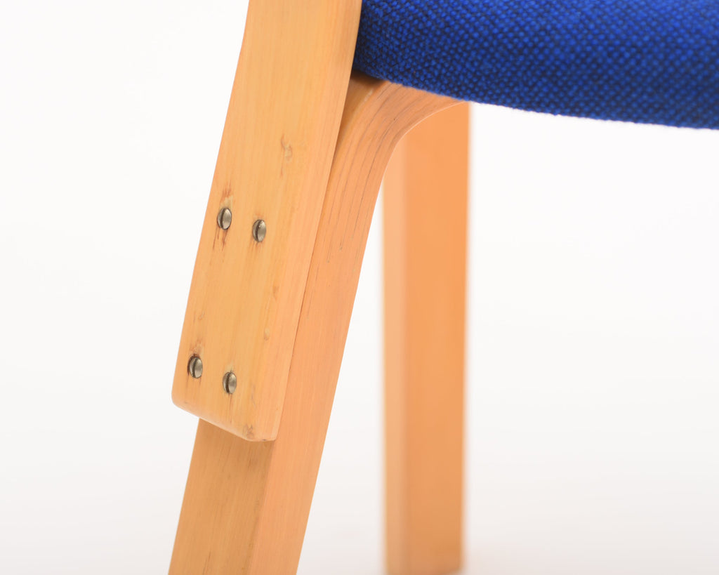 Rear close-up highlighting the screw-mounted connection between the backrest and rear legs.