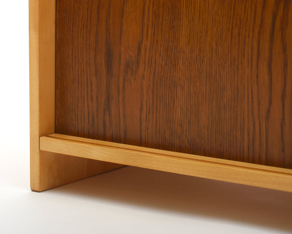 Close-up of a wooden cabinet with a focus on the corner.