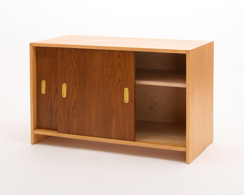 Full view of the 217 cabinet showing one sliding door open and part of the interior.