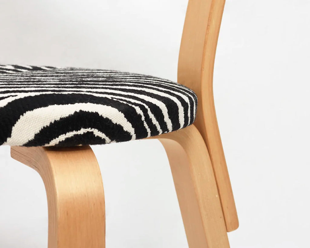 Close-up of a chair seat upholstered with Zebra fabric.