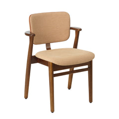 Front view of the Domus Chair in walnut‑stained birch, upholstered in Wow Re beige‑pink fabric with Prestige cognac leather piping.