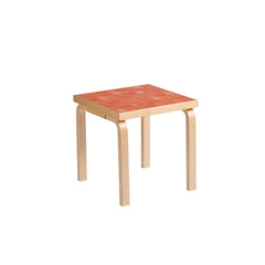 Artek + Heath Tile Table Square featuring a red‑toned ceramic tile surface and birch legs, measuring 44 x 44 x 44 centimeters.