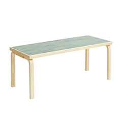 Artek + Heath Tile Table rectangular featuring a green‑toned ceramic tile surface and birch legs, measuring 109 x 44 x 44 centimeters.