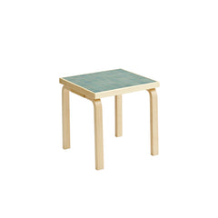 Artek + Heath Tile Table Square featuring a green‑toned ceramic tile surface and birch legs, measuring 44 x 44 x 44 centimeters.
