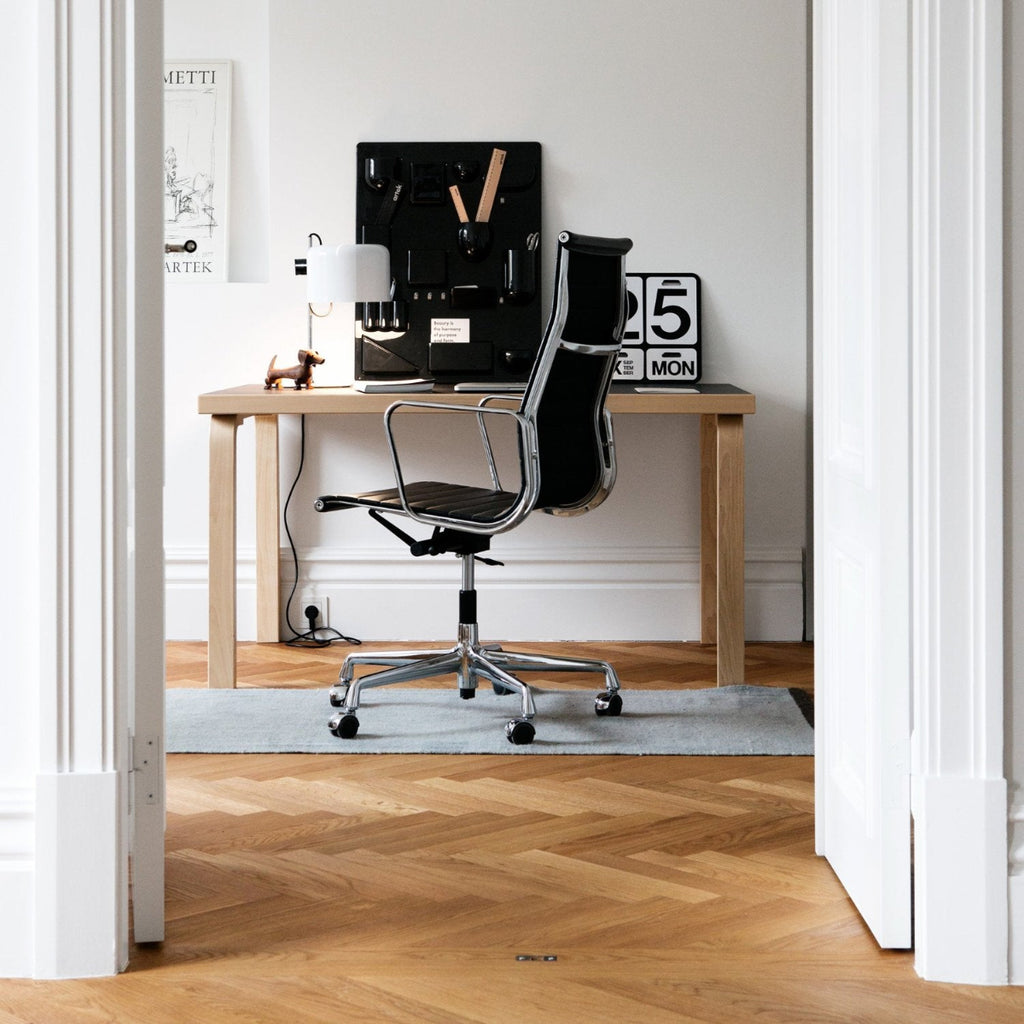 Interior view of a workspace featuring Aalto Table 80A with a black linoleum top.