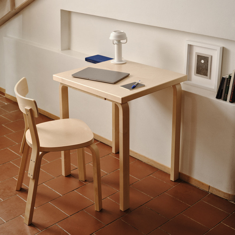 Compact home office featuring a square Aalto Table 80C with Chair 69 placed nearby, creating a calm and efficient workspace.