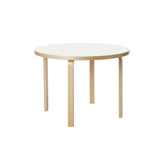 Aalto Table 90A (round) design by Alvar Aalto: legs and edge-band in natural lacquered solid birch, top surface in white laminate.
