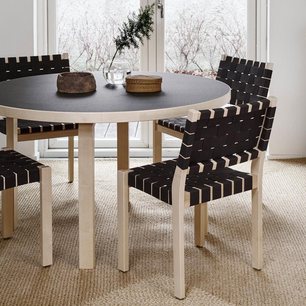 Dining area featuring Aalto Table 91 with a black linoleum top, surrounded by four Chair 611.