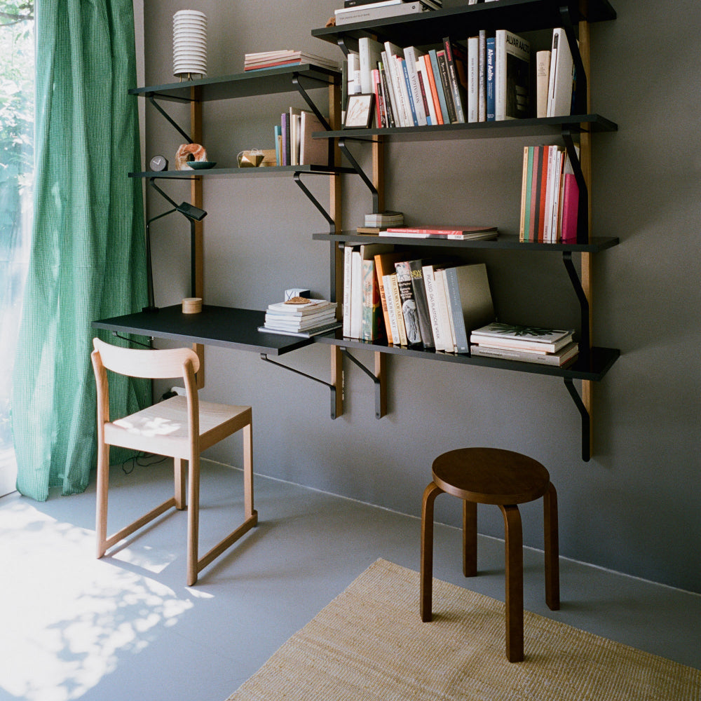 Home office interior featuring Artek Kaari Wall Shelf with desk and an Atelier Chair in clear lacquered oak, creating a calm and functional working area.