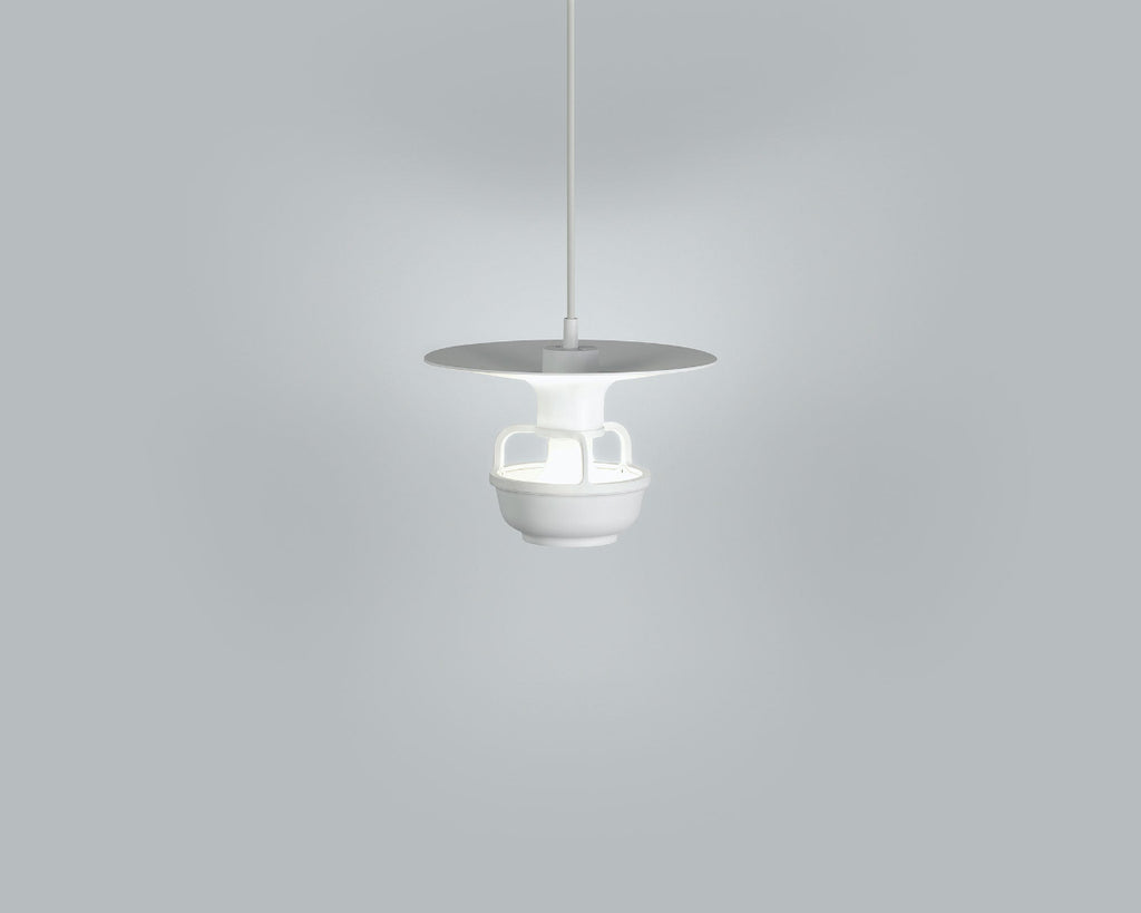 Product image of white Artek Kori Pendant Light with Disc Shade. The pendant light is switched on and photographed against a grey background.