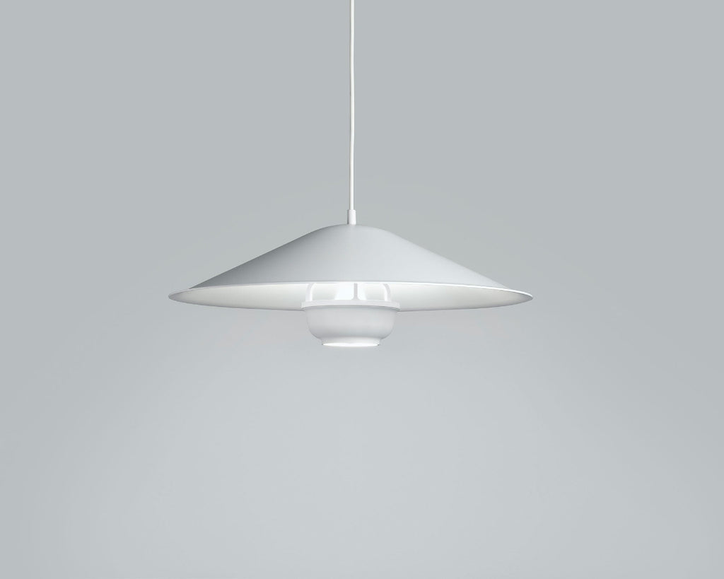 Product image of Artek Kori Pendant Light with Dune Shade. The pendant light is switched on.
