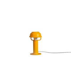 Kori Table Light designed by TAF Studio, featuring a bright matte orange aluminium shade with the Kori Collection’s unique 'basket' that casts a direct, glare-free light onto surfaces beneath.