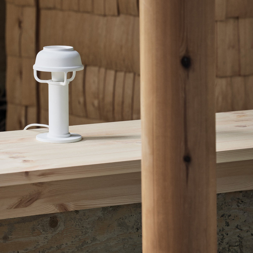 Interior view featuring white Kori Table Light switched off, placed on a table.