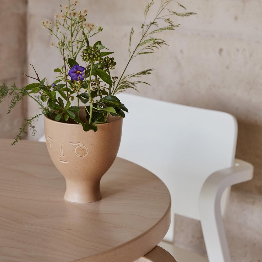 Interior view featuring a Midsummer Dream Vase placed on Table 90B. A white Aslak Chair is visible in the background.