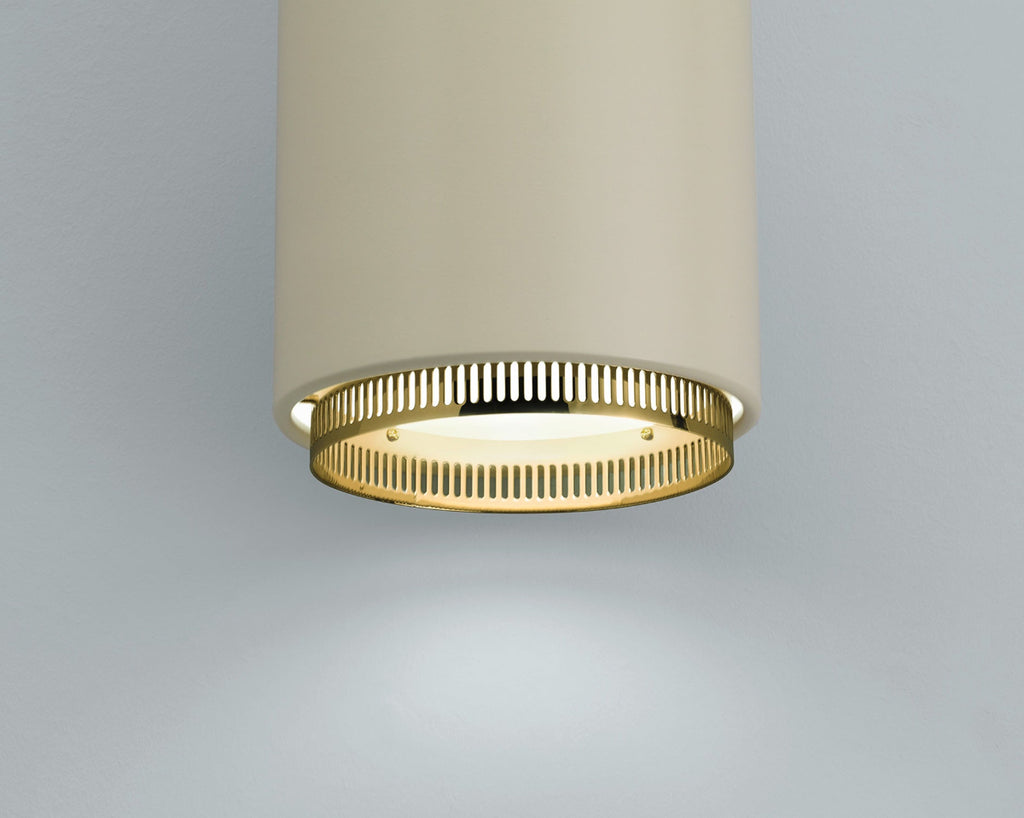 Close-up interior view featuring Pendant Light A110 “Hand Grenade” in duo-tone white linen, focusing on the lower section of the light.