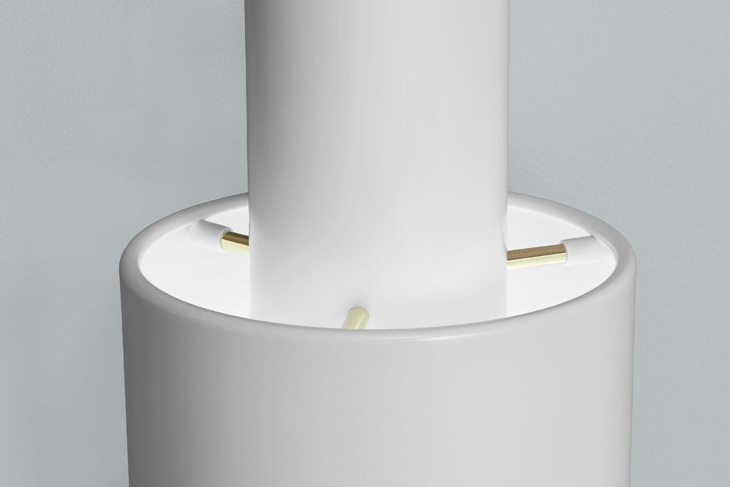 Close-up product image of white Artek Pendant Light A110, focusing on the details of the components. The pendant light is switched on and photographed against a grey background.