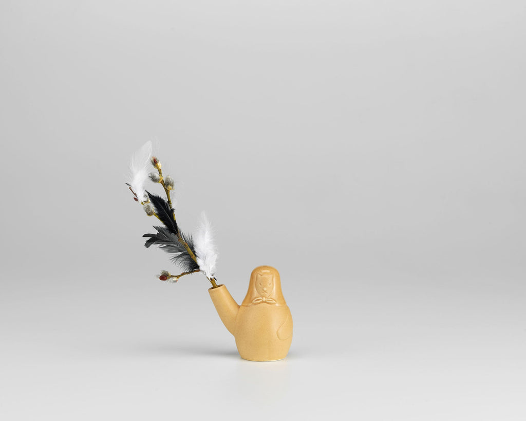 Product image of Artek Secrets of Finland Easter Dog Vase, photographed against a grey background. The vase is styled with the willow grove.