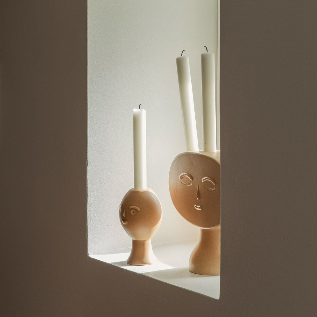 Interior view featuring Lucia Candleholder and Lucius Candleholder placed in a small window niche.