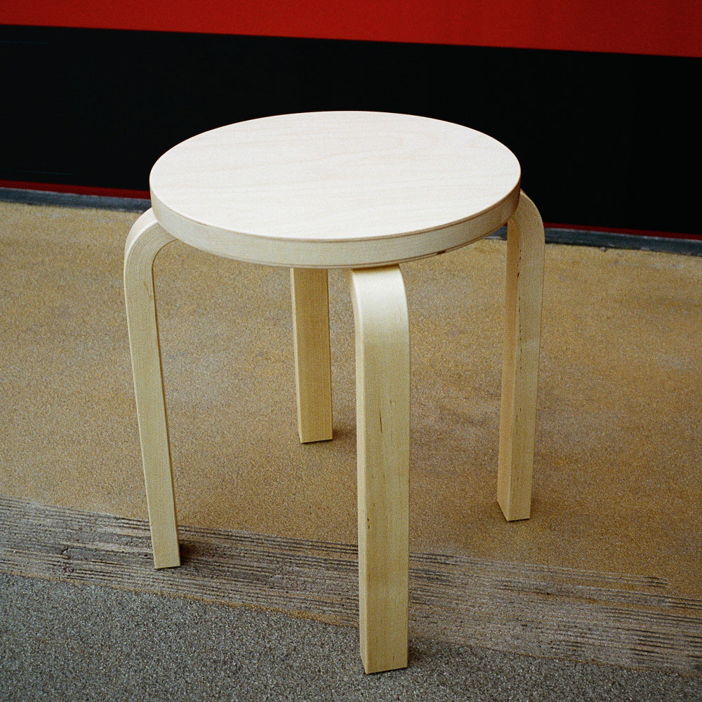 Interior view featuring a single Artek Stool E60 with a clear lacquer finish.