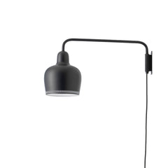 Wall Light A330S 'Golden Bell' designed by Alvar Aalto, featuring a lacquered steel shade in black with a perforated rim that filters light beautifully and prevents glare. The light comes with a black cable.