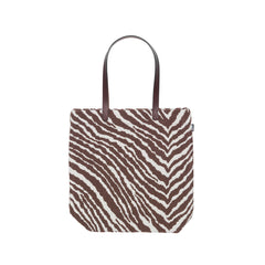 Product image of the Zebra Tote Bag featuring a brown and white Zebra pattern. The bag is made from Zebra fabric and photographed against a white background.